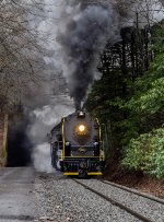 RBMN 2102 has it's booster engine engaged for extra traction while starting the 50 hopper car train on the Hometown Hill grade